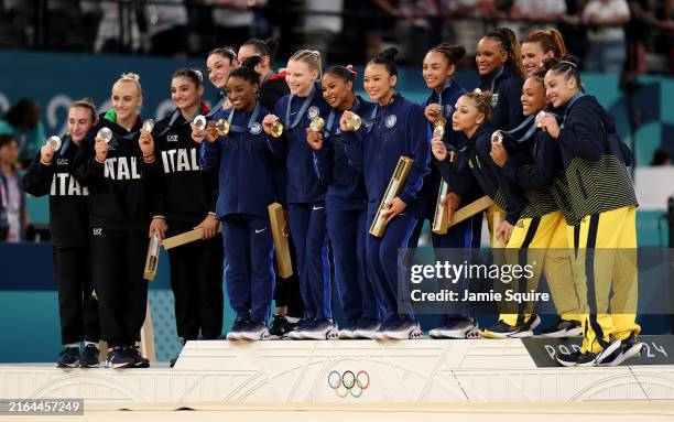 Silver medalists Team Italy, Gold medalists Team United States and Bronze medalists Team Brazil pose on the podium during the medal ceremony for the...