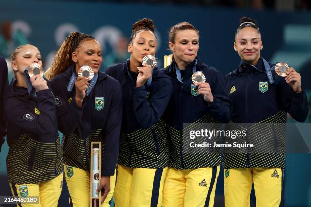 Bronze medalists Flavia Saraiva, Lorrane Oliveira, Rebeca Andrade, Jade Barbosa and Julia Soares of Team Brazil celebrate on the podium during the...