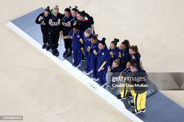 Silver medalists Team Italy, Gold medalists Team United States and Bronze medalists Team Brazil pose on the podium during the medal ceremony for the...