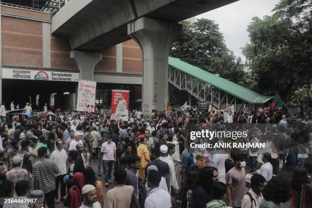 Activists take part in a protest as they demand justice for victims arrested and killed in the recent countrywide violence among Anti-Quota...