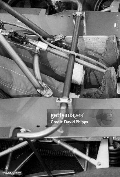 The feet and legs of Ronnie Peterson in the footwell of the Tyrrell P34. XII Race of Champions, Brands Hatch, England, 20 March 1977.