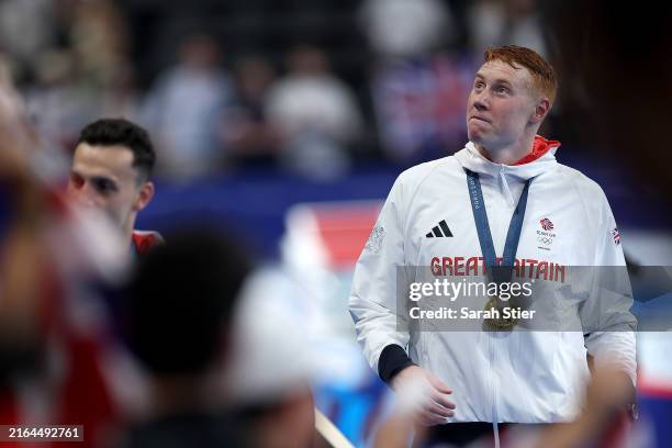 Gold Medalist Tom Dean of Team Great Britain is seen with his medal following the Swimming medal ceremony after the Men's 4x200m Freestyle Relay...