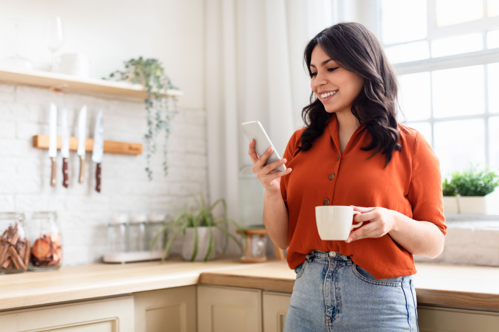 Happy woman with phone and coffee mug Happy woman with phone and coffee mug