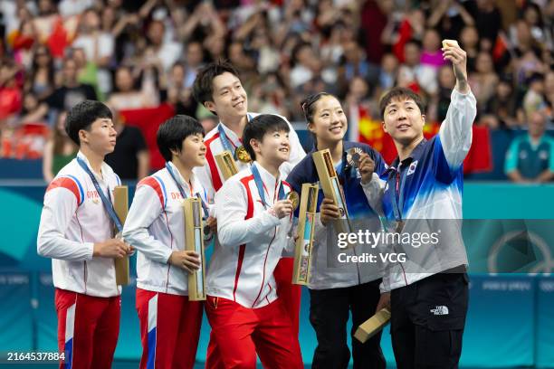Gold medalists China's Wang Chuqin and Sun Yingsha, silver medalists North Korea's Ri Jong Sik and Kim Kum Yong, bronze medalists South Korea's Lim...