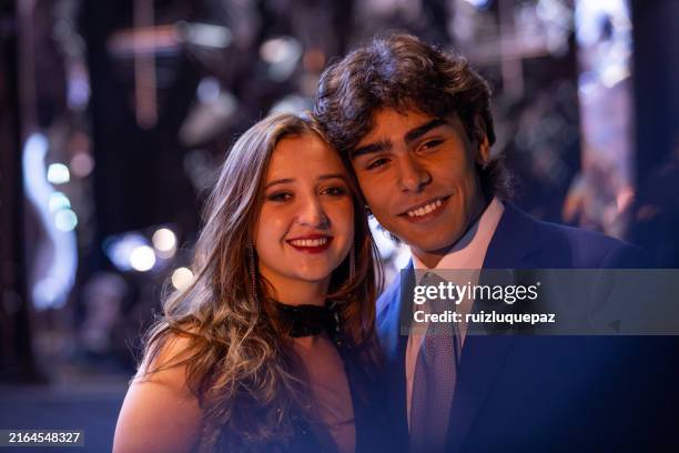 young man with his boyfriend at the graduation party - prom kisses stock pictures, royalty-free photos & images