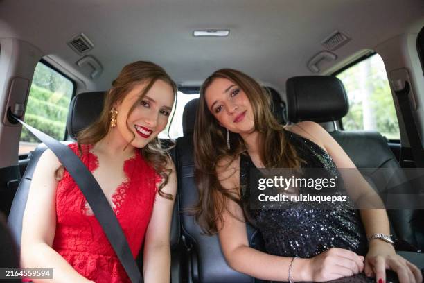 graduates in the car going to their graduation party - baile de finalistas imagens e fotografias de stock