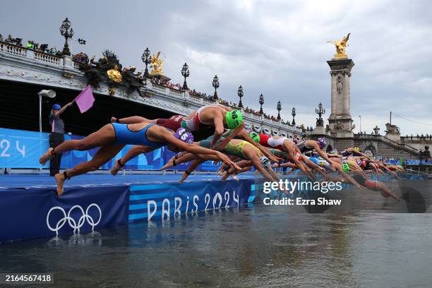General view as competitors start the swimming leg of the Women's Individual Triathlon on day five of the Olympic Games Paris 2024 at Pont Alexandre...