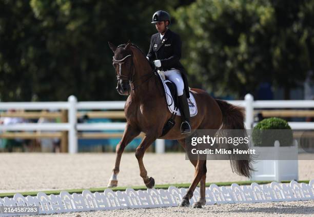 Anush Agarwalla and horse Sir Caramello Old of Team India compete in the Dressage Grand Prix Team and Individual Qualifier on day five of the Olympic...