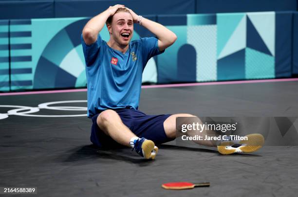 Truls Moregard of Team Sweden reacts during the Men's Singles Round of 32 match between Chuqin Wang of Team People’s Republic of China and Truls...