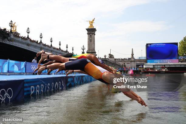 General view as competitors start the swimming leg of the Men's Individual Triathlon on day five of the Olympic Games Paris 2024 at Pont Alexandre...