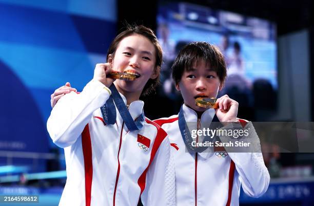 Gold Medalists Chen Yuxi and Quan Hongchan of Team People's Republic of China pose following the Diving medal ceremony after the Women's Synchronised...