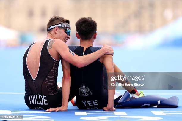 Gold medalist Alex Yee of Team Great Britain and Silver medalist Hayden Wilde of Team New Zealand celebrate after crossing the line during Men's...