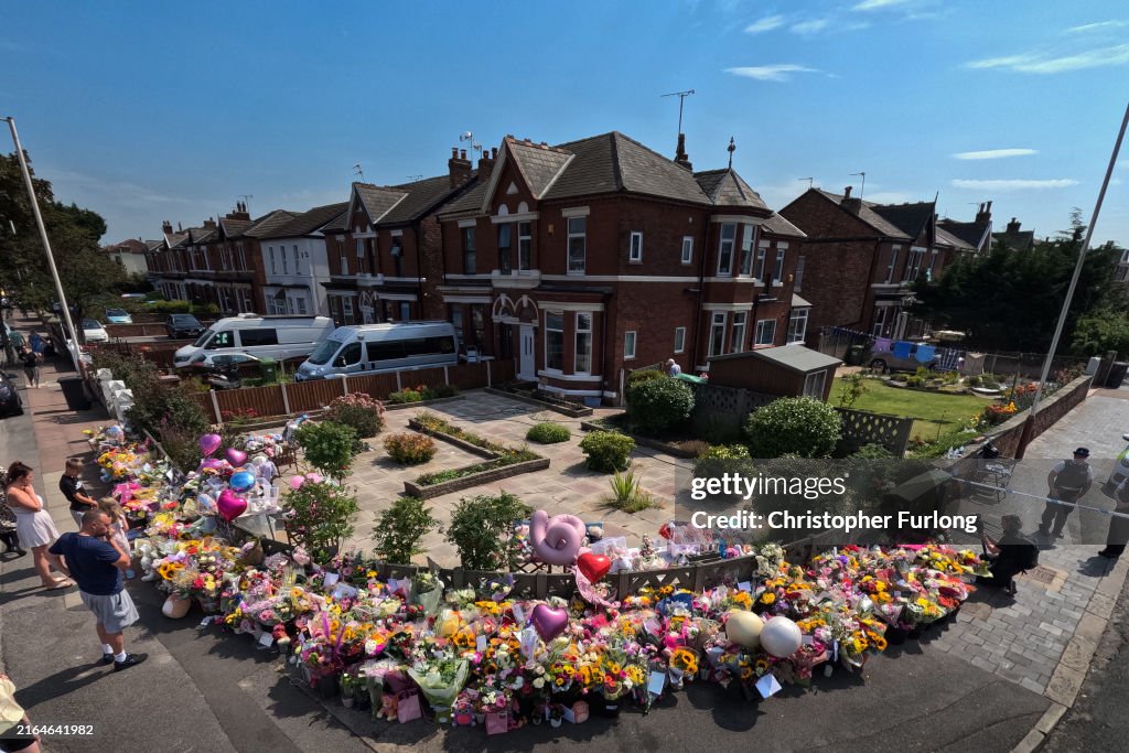 Flowers And Tributes Are Left At The Scene Of Monday's Stabbings In Southport