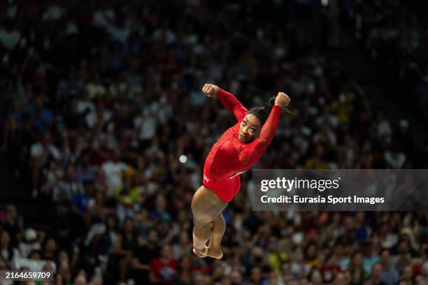 Silver medalist Rebeca Andrade of Team Brazil and gold medalist Simone Biles of Team USA shake hands after the women's artistic gymnastics vault...