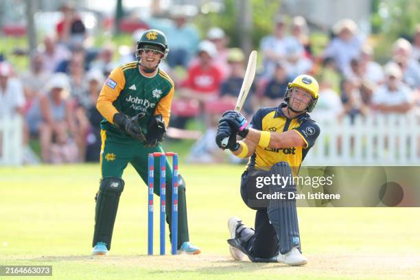 Colin Ingram of Glamorgan bats as Tom Moores of Nottinghamshire watches on during the Metro Bank One Day Cup match between Glamorgan and...