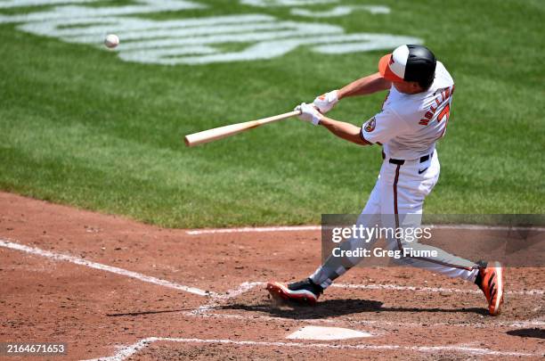 Jackson Holliday of the Baltimore Orioles hits a grand slam for his first career home run in the fifth inning against the Toronto Blue Jays at Oriole...