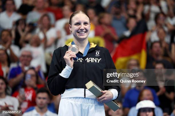 Bronze Medalist Isabel Gose of Team Germany poses on the podium during the Swimming medal ceremony after the Women's 1500m Freestyle Final on day...