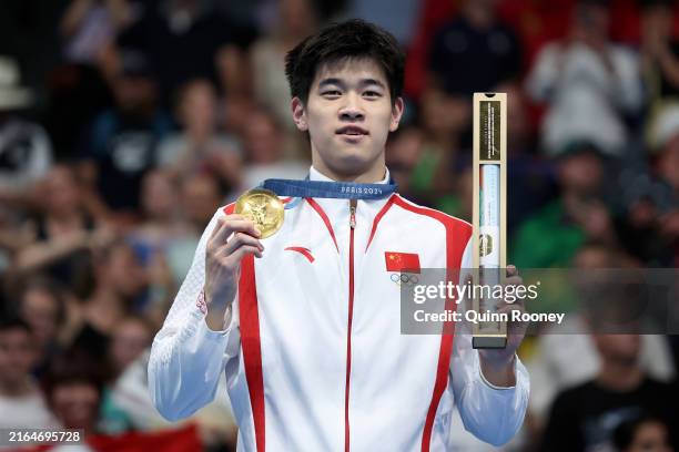 Gold Medalist Zhanle Pan of Team People's Republic of China poses on the podium during the Swimming medal ceremony after the Men's 100m Freestyle...