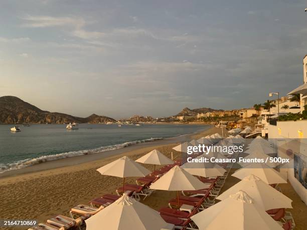 scenic view of beach against sky,cabo san lucas,mexico - cabo san lucas stock pictures, royalty-free photos & images