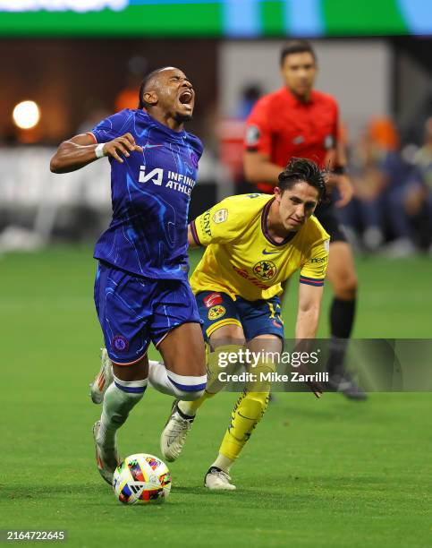Forward Christopher Nkunku of Chelsea FC reacts after being tripped by midfielder Alan Cervantes of Club America during the pre-season friendly match...