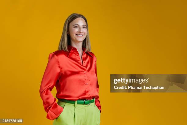 woman wearing smart casual outfit - satin shirt stock pictures, royalty-free photos & images