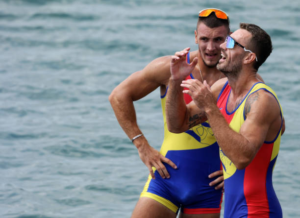 Andrei Sebastian Cornea and Marian Florian Enache of Team Romania celebrate winning the gold medals after competing in the Men's Double Sculls Final...