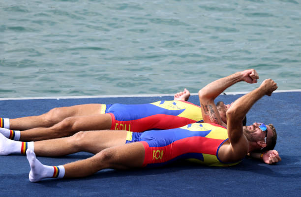 Andrei Sebastian Cornea and Marian Florian Enache of Team Romania celebrate winning the gold medals after competing in the Men's Double Sculls Final...