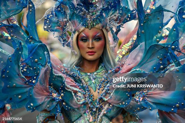 An Indonesian performer dressed in costumes parades during the Jember Fashion Carnival, in eastern Java island on August 4, 2024. The annual parade...