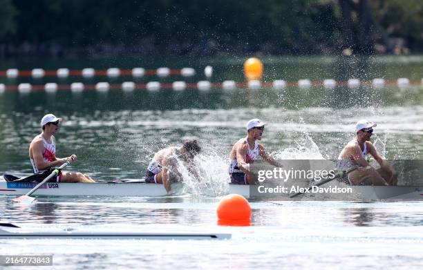 Nick Mead, Justin Best, Michael Grady and Liam Corrigan of Team United States celebrate winning the gold medals after competing in the Rowing Men's...