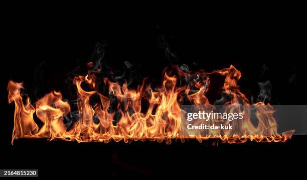 fire burning line on black background. can be used as overlay design element with add or screen blending mode - flame stock pictures, royalty-free photos & images