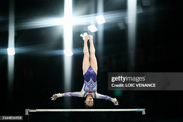 China's Qiu Qiyuan competes in the artistic gymnastics women's uneven bars final during the Paris 2024 Olympic Games at the Bercy Arena in Paris, on...