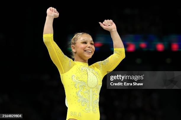 Flavia Saraiva of Team Brazil reacts after finishing her routine on the balance beam during the Artistic Gymnastics Women's All-Around Final on day...
