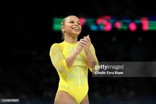 Flavia Saraiva of Team Brazil reacts after finishing her routine on the balance beam during the Artistic Gymnastics Women's All-Around Final on day...