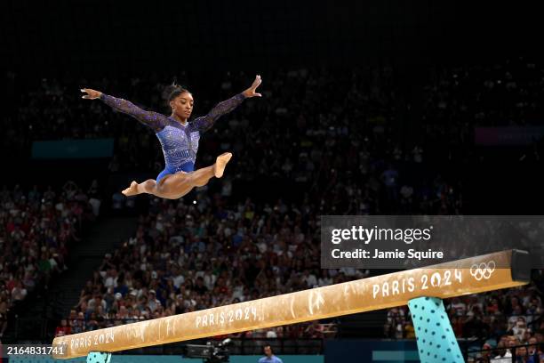 Simone Biles of Team United States competes on the balance beam during the Artistic Gymnastics Women's All-Around Final on day six of the Olympic...