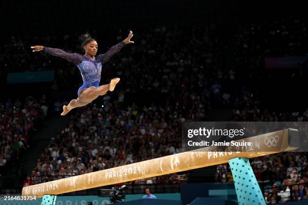 Simone Biles of Team United States competes on the balance beam during the Artistic Gymnastics Women's All-Around Final on day six of the Olympic...
