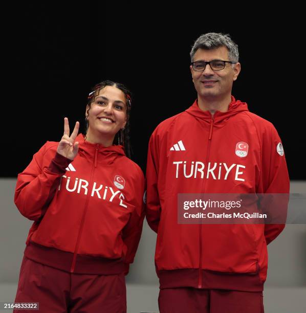 Silver medalists Sevval Ilayda Tarhan and Yusuf Dikec of Team Turkiye pose on the podium during the Shooting 10m Air Pistol Mixed Team medal ceremony...