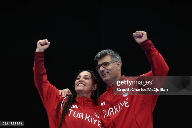 Silver medalists Sevval Ilayda Tarhan and Yusuf Dikec of Team Turkiye pose on the podium during the Shooting 10m Air Pistol Mixed Team medal ceremony...