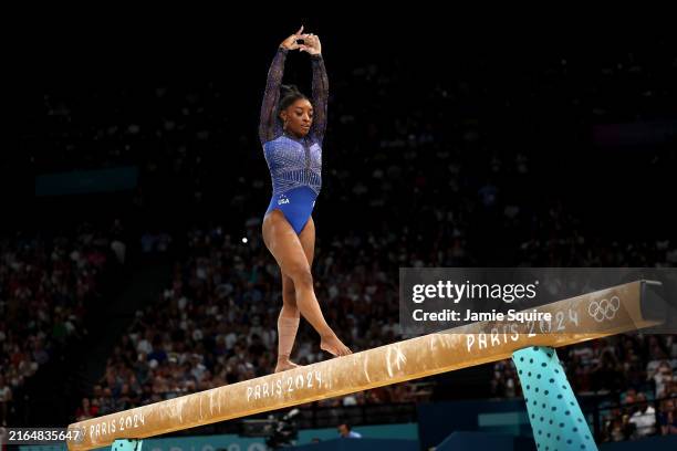 Simone Biles of Team United States competes on the balance beam during the Artistic Gymnastics Women's All-Around Final on day six of the Olympic...