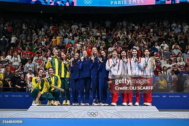 Gold medallists Team USA , silver medallists team Australia and bronze medallist team China pose on the podium of the women's 4x100m medley relay...