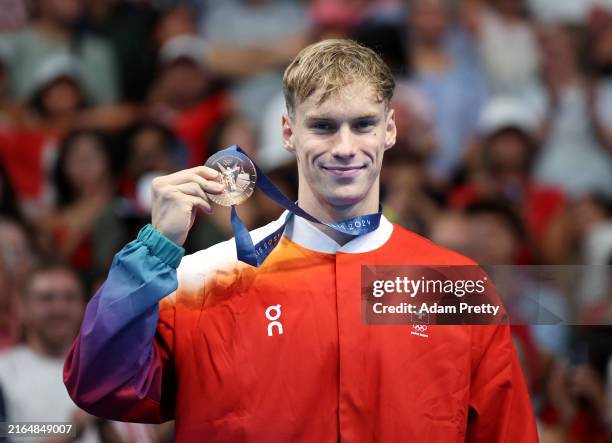 Bronze Medalist Roman Mityukov of Team Switzerland poses on the podium during the Swimming medal ceremony after the Men's 200m Backstroke Final on...
