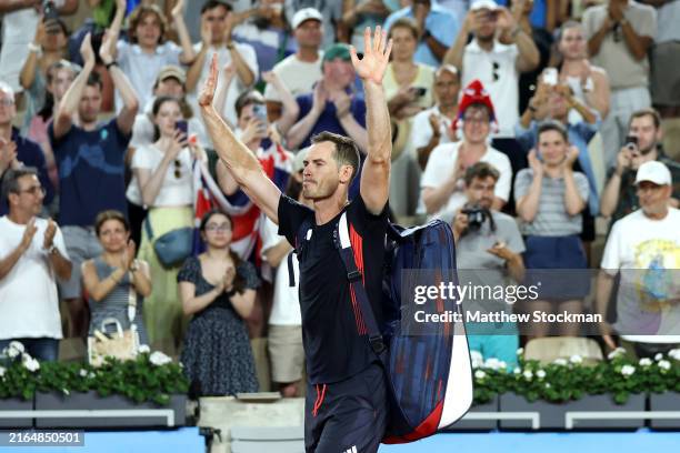 Andy Murray of Team Great Britain acknowledges the crowd with partner Daniel Evans of Team Great Britain after losing match point against Taylor...