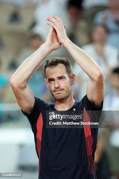 Andy Murray of Team Great Britain acknowledges the crowd with partner Daniel Evans of Team Great Britain after losing match point against Taylor...