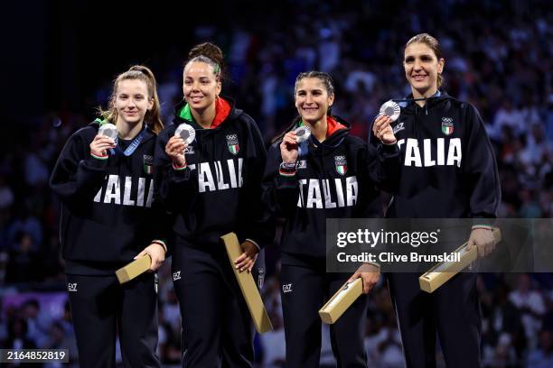 Silver medalists of Team Italy celebrate on the podium during the Women's Foil Team medal ceremony on day six of the Olympic Games Paris 2024 at...