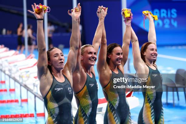 Mollie O’Callaghan, Lani Pallister, Brianna Throssell and Ariarne Titmus of Team Australia celebrate after winning gold in the Women's 4x200m...