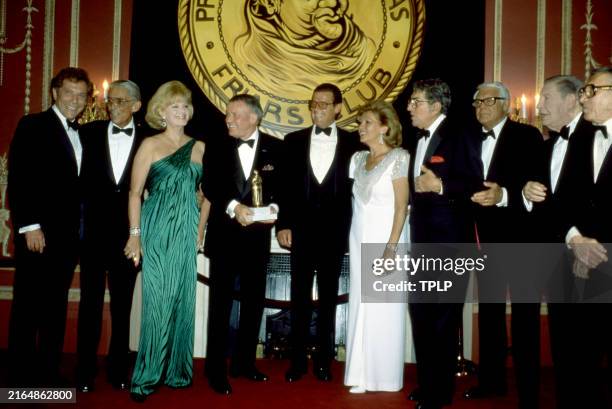 George Segal , an unidentified man, Barbara Sinatra , Frank Sinatra , Roger Moore , Luisa Moore , Dean Martin , Cary Grant , Milton Berle and David...