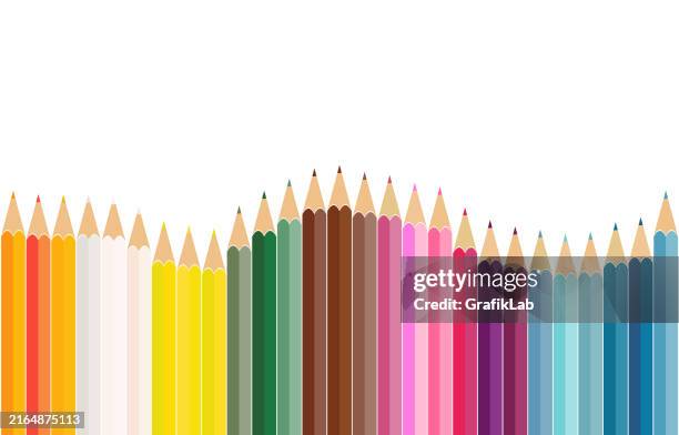 colorful pencils arranged in a wave pattern on white background - colored pencil stock illustrations