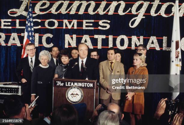 Vice President Hubert Humphrey concedes the presidential election to his opponent Richard Nixon as family members stand behind him at Democratic...