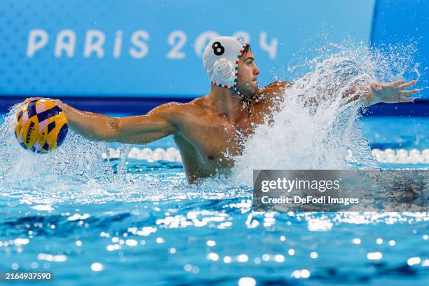 Gergo Janos Fekete of Hungary controls the ball during the Water polo Men's Group B match between Hungary and Serbia on Day 10 of the Olympic Games...