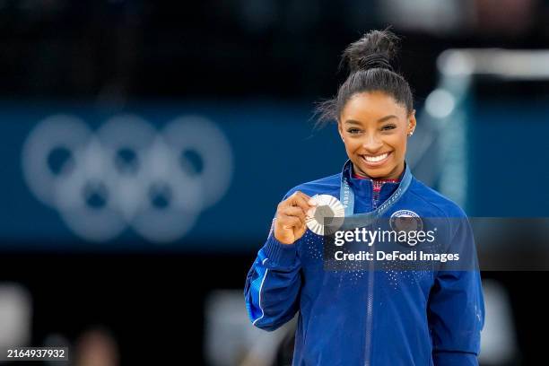 Silver medalist Simone Biles of USA celebrates during the Women's Artistic Gymnastics Floor Exercise Final medal ceremony on Day 10 of the Olympic...