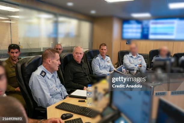 Israeli Defense Minister Yoav Gallant , visits the IAF command center to assess the situation with Israel Air Force Commander Major General Tomer Bar...